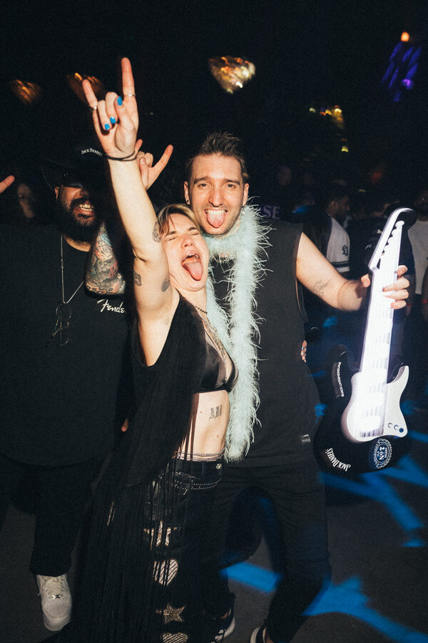 Celebrating a set with a guitar held high